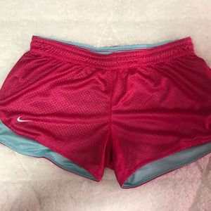 Dark pink with light blue lining Nike shorts